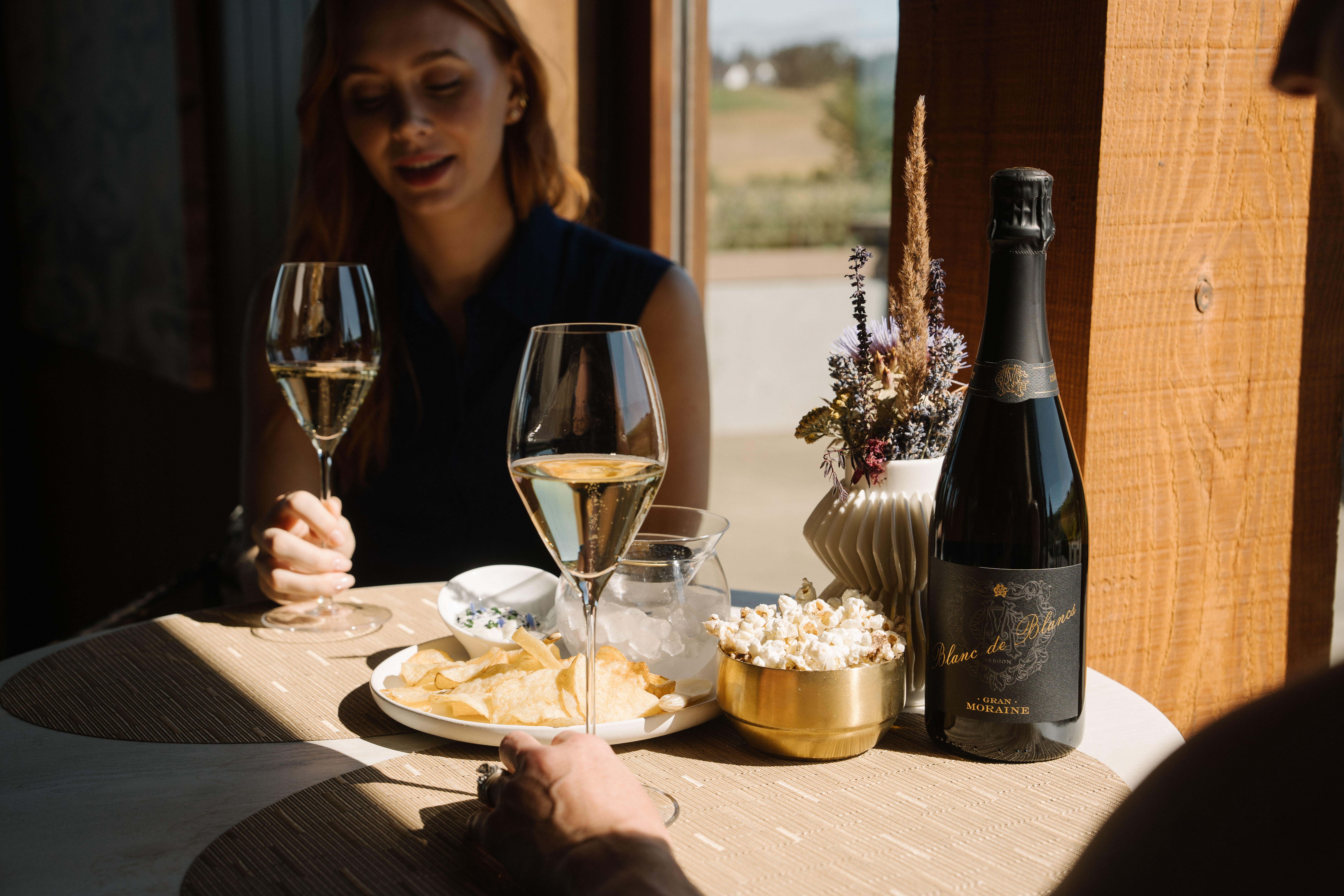 Gran Moraine tasting room view during an afternoon sunset from lawn